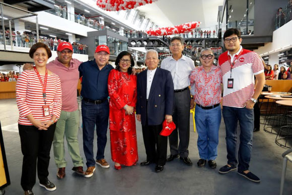 Executives from AirAsia and AirAsia X with Malaysian Aviation Commission executive chairman, Mohamed Khadar, fifth from left, at the airline's new corporate office, RedQ.