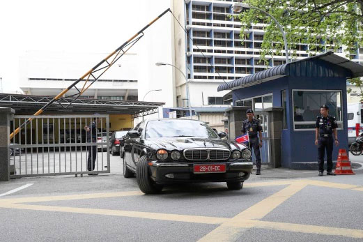 The car of ambassador of North Korea to Malaysia is leaving the forensic department at the hospital in Kuala Lumpur.