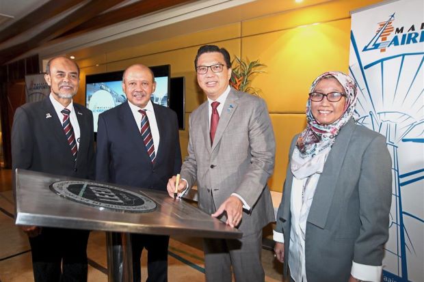 On cloud nine: (From left) Malaysia Airports senior general manager Zainol Mohd Isa, Malaysia Airports chairman Tan Sri Syed Anwar Jamalullail, Liow and Dr Puteri Shireen at the presentation of klia2 Gold LEED certificate in klia2.
