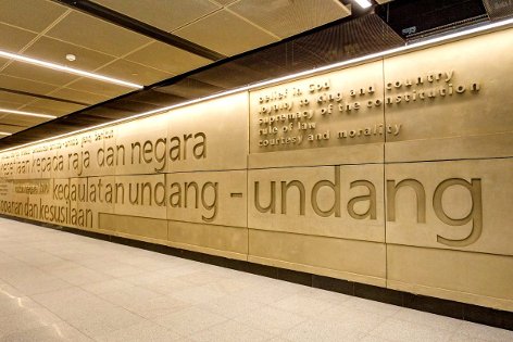 Wall featuring text of text of Rukun Negara, the Malaysian national pledge, on upper concourse level