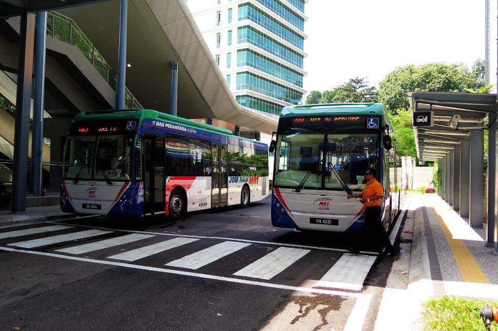 Feeder buses waiting at bus stop near entrance A