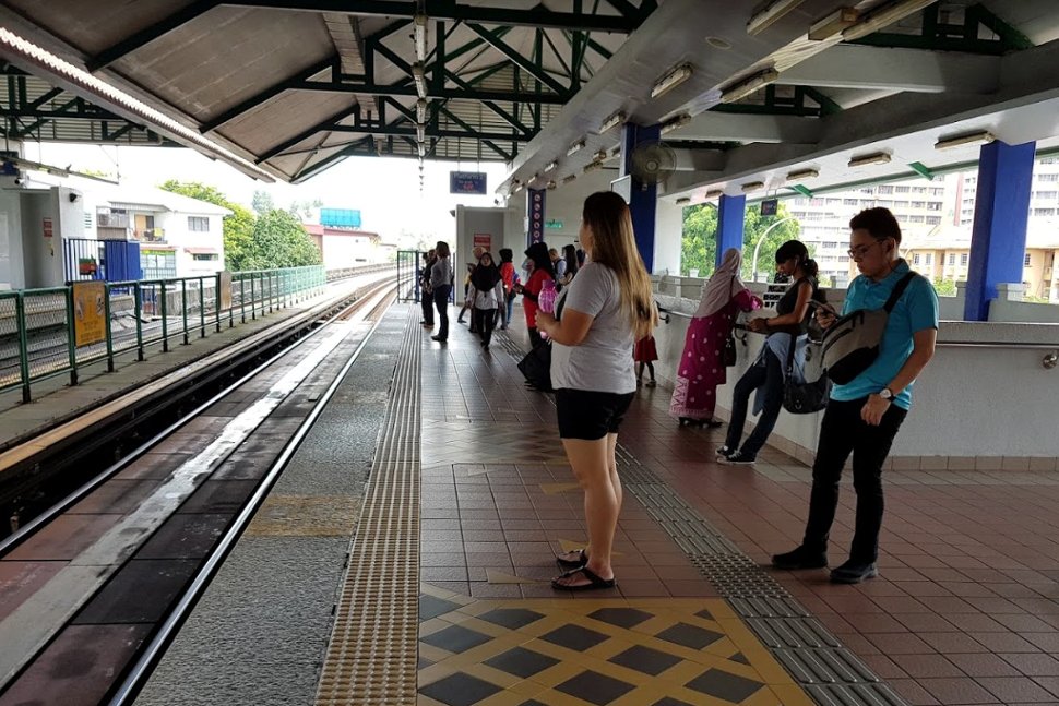 Commuters waiting at boarding platform