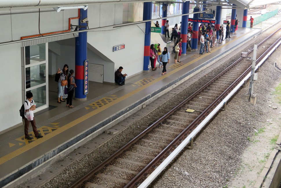 Commuters waiting at Tasik Selatan LRT station