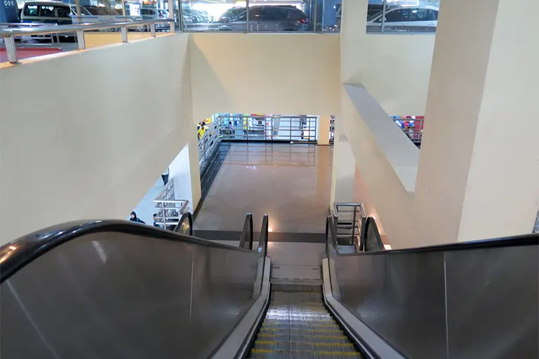 Use the escalator to go down to Level 1