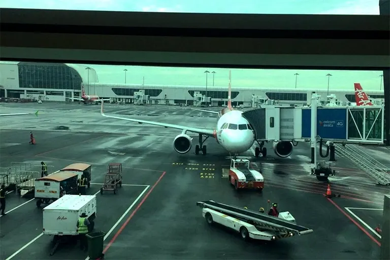 View of AirAsia flight connected to the Aerobridge