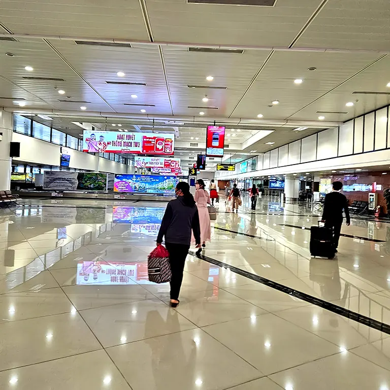 Passengers walking to the baggage collection area