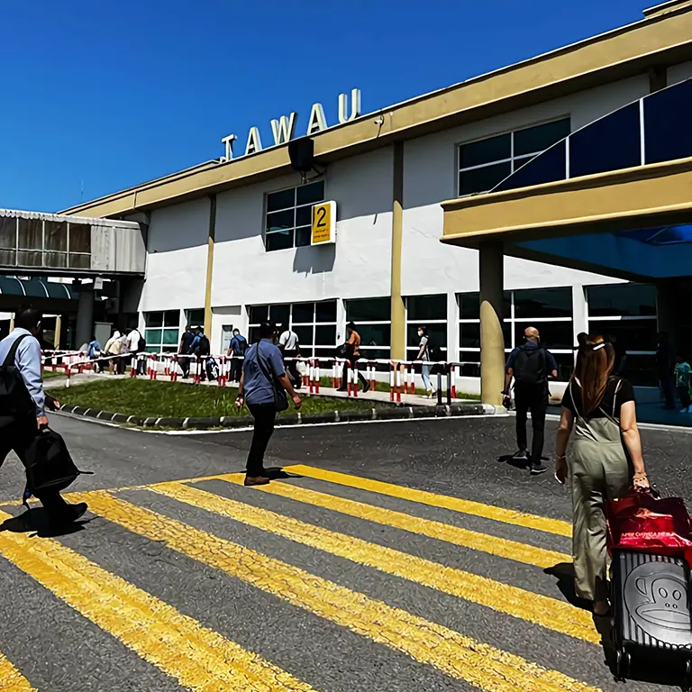 Passengers walking to the Terminal building at Tawau International Airport