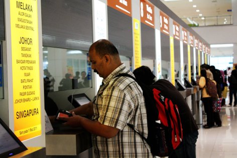 Passenger buying ticket at the counter