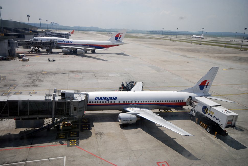 Malaysia Airlines flights parking at the contact pier