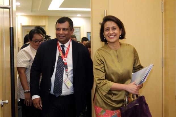 Fernandes and AirAsia chief executive officer Aireen Omar leaving after a closed door meeting with Liow.