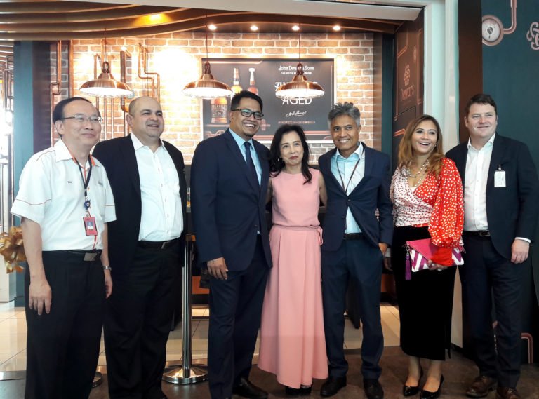 Partnership spirit: Malaysia Airports, Eraman and Bacardi GTR teams salute the Bar Metropole opening.