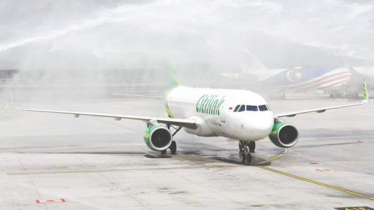 Citilink Indonesia’s aircraft being given a water salute upon landing at KLIA. BERNAMAPIX