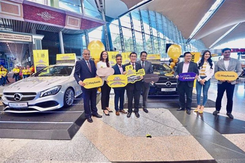 (From left) Maybank Financial Services Group Community head of cards B. Ravintharan, Diageo Private Ltd Co account controller Louise Wortley, Malaysia Airports Holdings Berhad commercial services senior general manager Mohammad Nazli Abdul Aziz, Raja Azmi, Malaysia Airports Niaga Sdn Bhd general manager Zulhikam Ahmad, Petron Fuel International Sdn Bhd marketing manager Danny Chen and celebrity guests Zahirah MacWilson and Fattah Amin at the launch of the Eraman Shopping Extravaganza 25AmazingYears Contest where two Mercedes Benz CLA Coupe 200 AMG Line are up for grabs. — RAJA FAISAL HISHAN/The Star