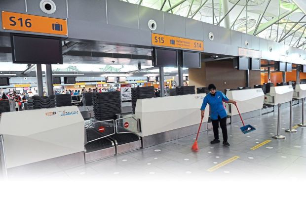 Grounded: Rayani Air check-in counters at klia2 are empty following its suspension. (Inset) Department of Civil Aviation (DCA) directorgeneral Datuk Seri Azharuddin Abdul Rahman showing the press statement detailing the suspension of Rayani Air flight operations.