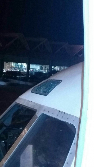 The shattered cockpit window of the Rayani airliner. Picture courtesy of Rayani Airlines CEO Ravi Alagendrran