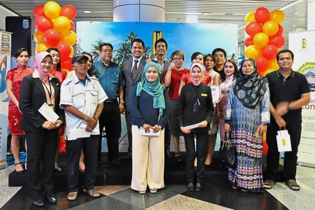 Zulhikam (back row, fifth from left) with contest winners at the prize-giving ceremony.