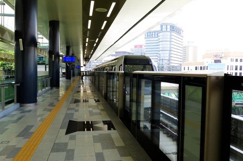 An MRT train leaving the platform level