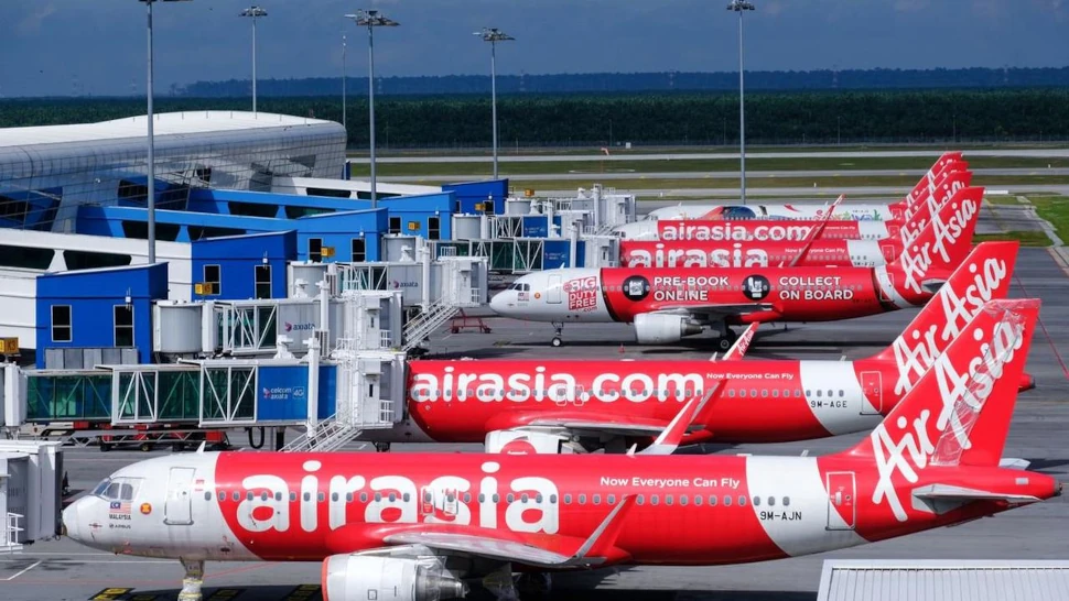 AirAsia Group Bhd. aircraft stand on the tarmac at Kuala Lumpur International Airport 2 (KLIA 2) in Sepang, Selangor, Malaysia, on Monday, Aug. 24, 2020. AirAsia is scheduled to report its quarterly results on Aug. 28. Photographer: Samsul Said/Bloomberg , Bloomberg