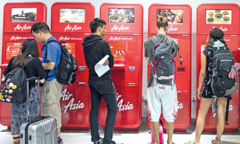 Passengers at the AirAsia's sales kiosks