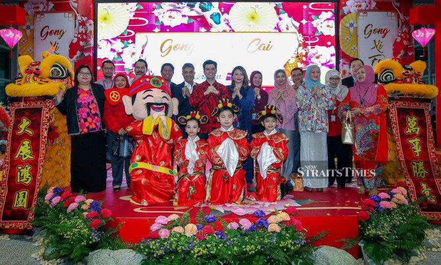 Malaysia Airports Holdings Bhd acting group chief executive officer Datuk Mohd Shukrie Mohd Salleh (seventh from left) with senior management team at the launch of Chinese New Year campaign at KLIA in Sepang, yesterday. NST pix by Luqman Hakim Zubir.