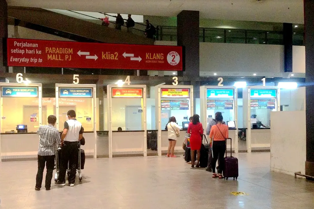 Passengers buying ticket at the ticketing counters