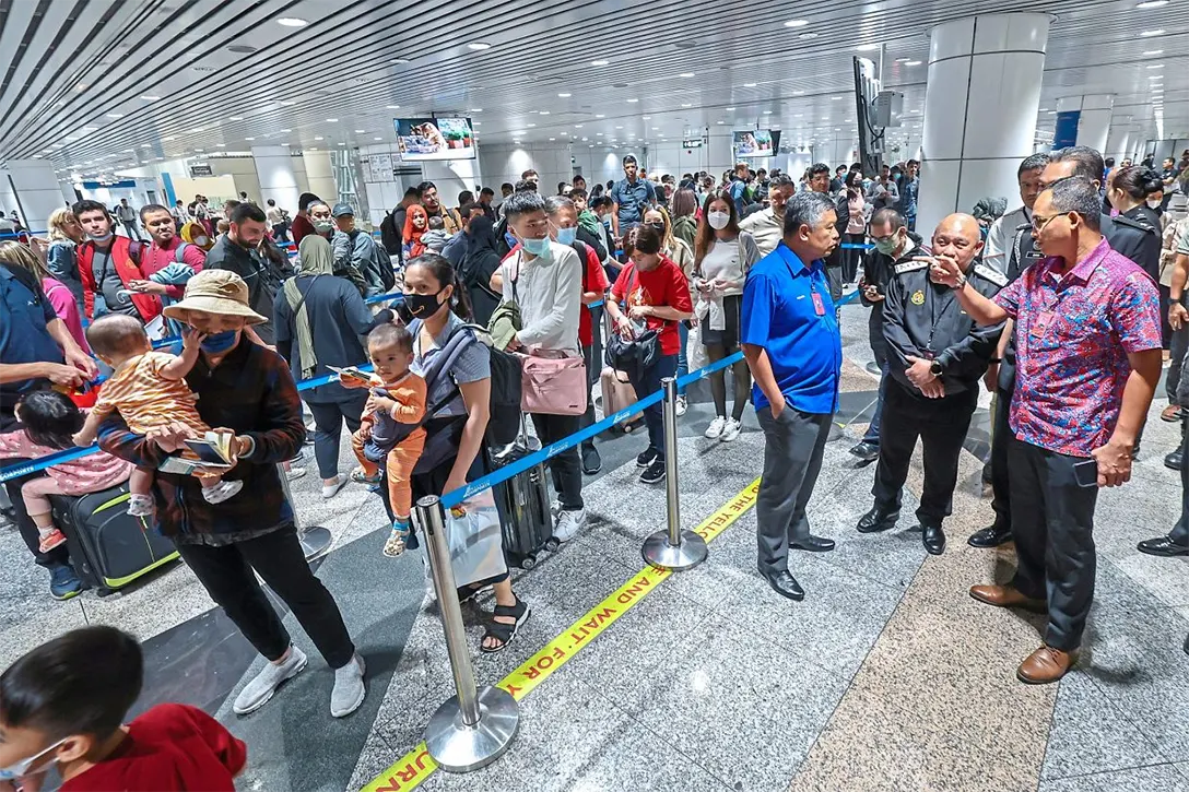 Need for speed: Khairul Dzaimee (right) observing the flow at the check-in counters at KLIA. — Bernama