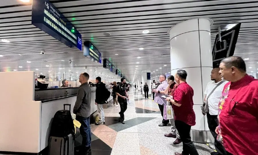 Tourism Minister Datuk Seri Tiong King Sing (5th from right) hits out at Immigration Department for slow checking procedures at the Kuala Lumpur International Airport (KLIA) for incoming travelers. - Pic courtesy of Tourism Ministry
