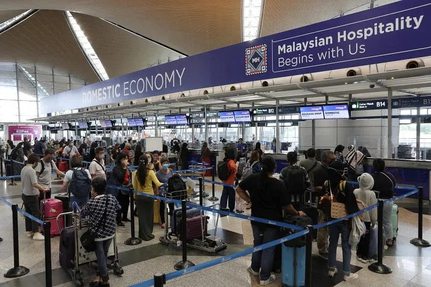 Long immigration lines and luggage waiting times need a serious revamp to attract more tourists. PHOTO: BERNAMA