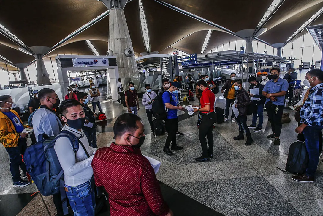 Travellers are seen with their luggage at the Kuala Lumpur International Airport on Oct 17, 2021. – Malay Mail photo