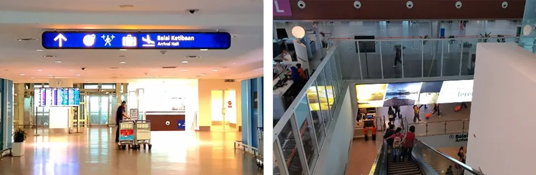 Escalators and lifts at the end of Skybridge and passengers going down to Arrival Hall