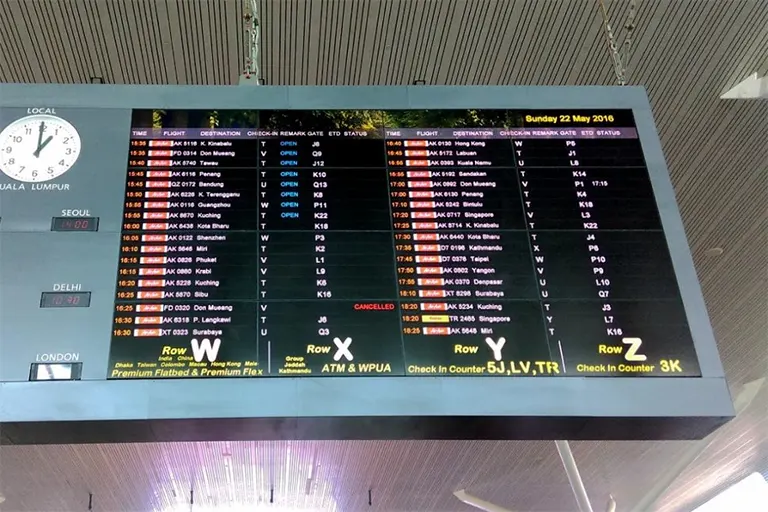 Giant monitor at the Departure Hall displaying the flight schedule and status