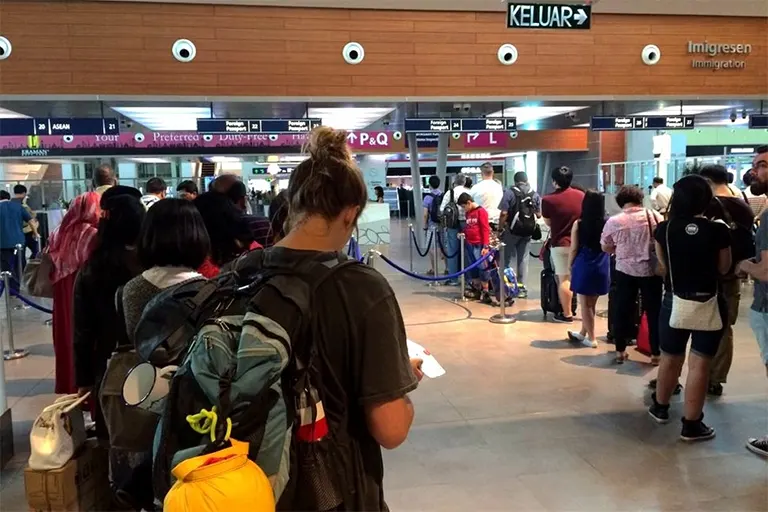 Passengers queuing up for document check at the Immigration counters