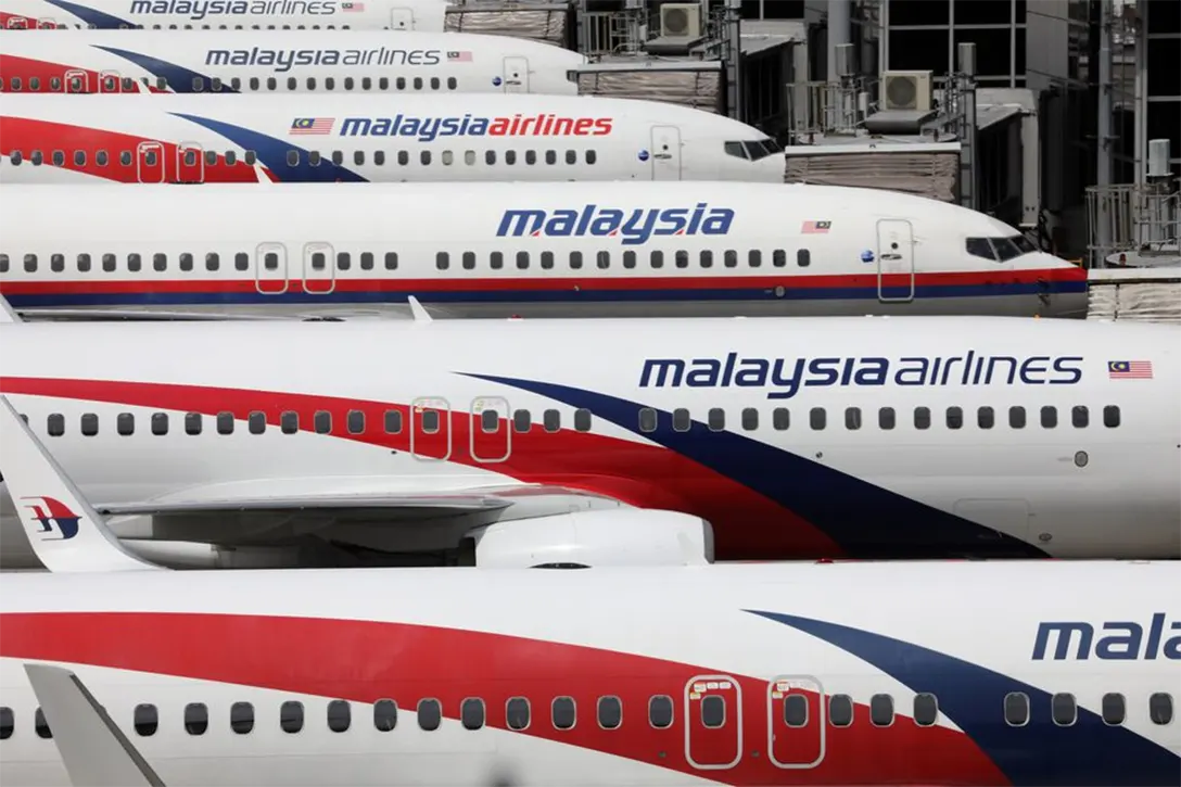Malaysia Airlines planes are seen parked at Kuala Lumpur International Airport. REUTERS/Lim Huey Teng