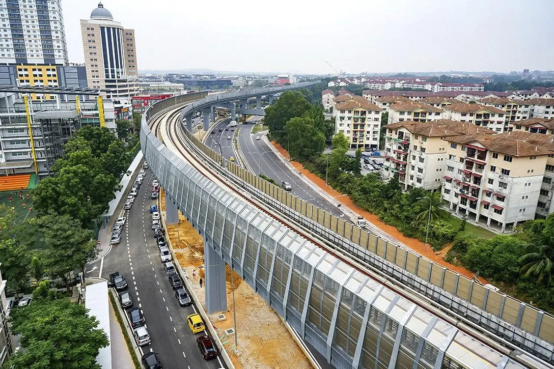 The guideway heading out of the Kota Damansara Station with sound barriers installed.
