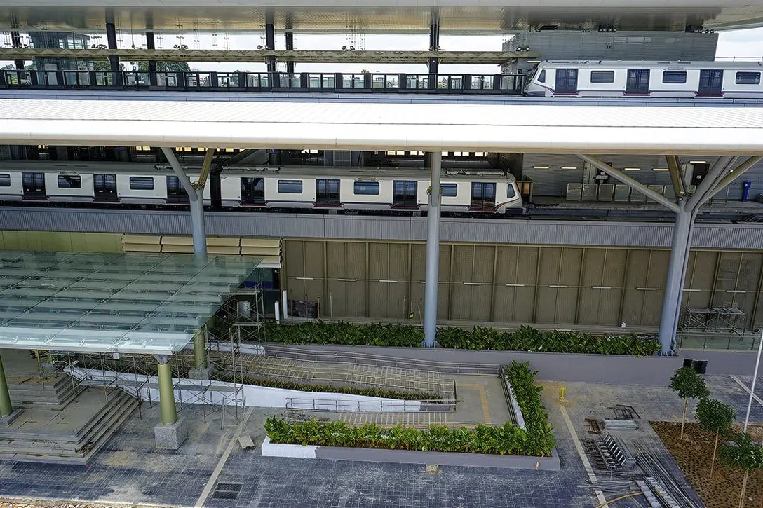 Two MRT trains undergoing test runs at the Kwasa Damansara Station.