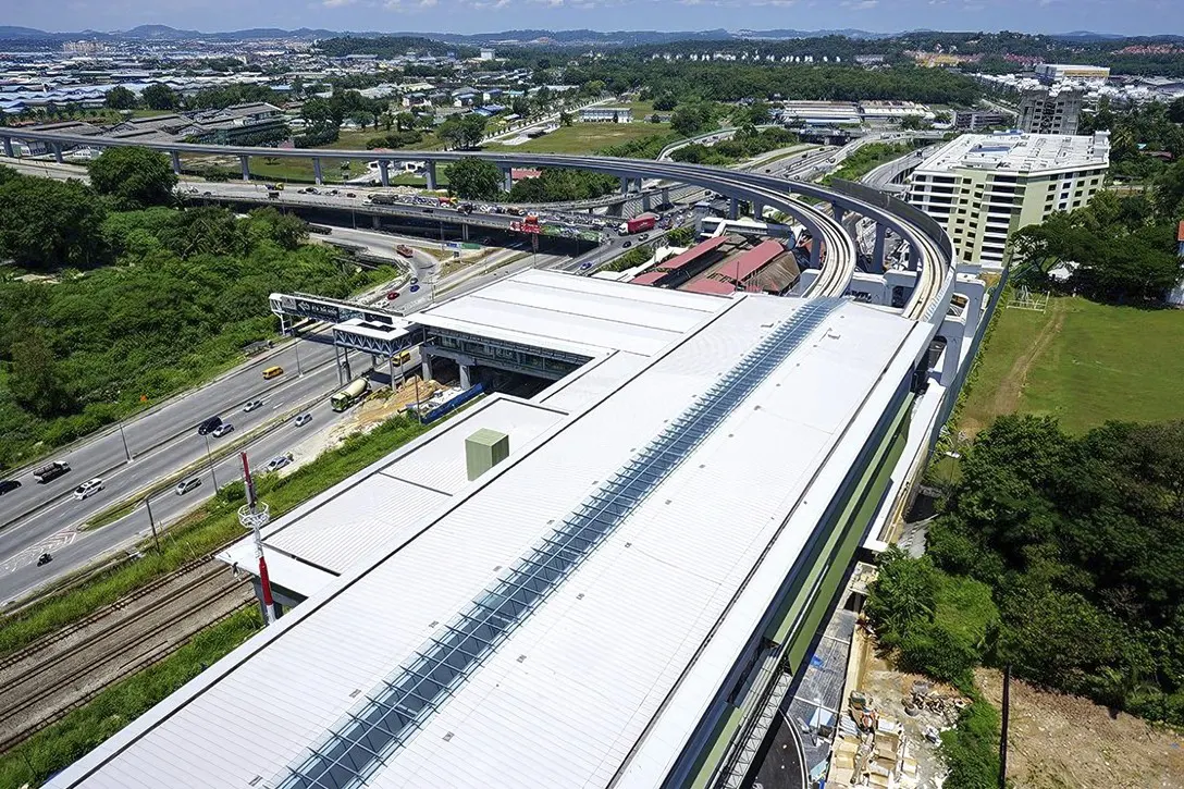 View of the Sungai Buloh MRT Station (white roof) with the common concourse with the Sungai Buloh KTM Station (red roof)