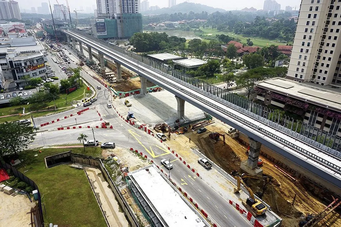 Aerial view of the MRT guideway with the construction of the Persiaran Mahagoni intersection underpass in progress.
