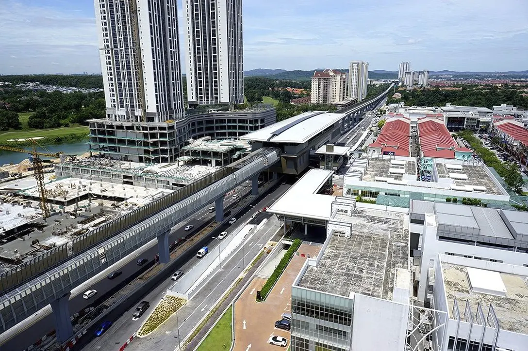 View of the completed Surian Station with its pedestrian link bridge to the adjacent buildings being constructed.