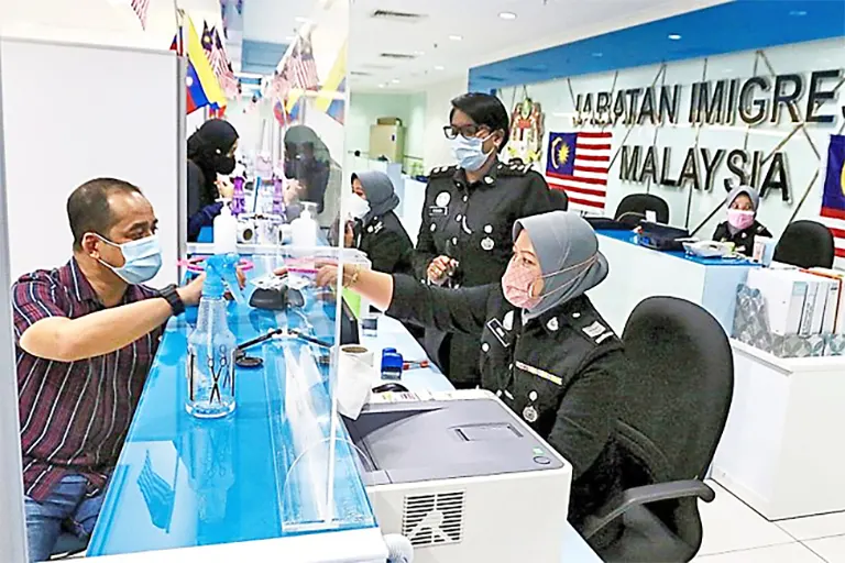 Counters operating at an Immigration office in Malaysia. PHOTO: THE STAR