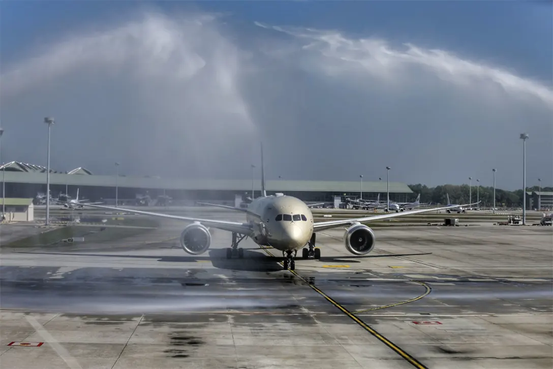 A plane receives a water cannon salute upon arrival at KLIA after Malaysia reopened its borders, April 1, 2022. — Picture by Ahmad Zamzahuri