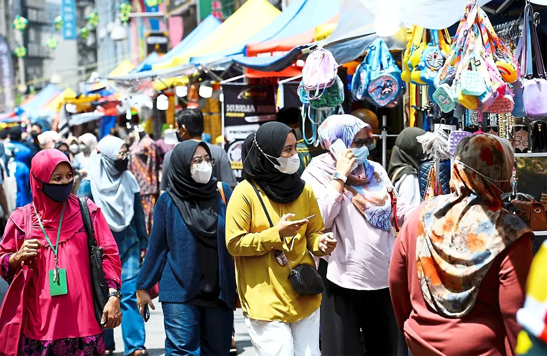 Easing back in: As the country heads towards endemicity, more people are beginning to enjoy shopping as normal ahead of Hari Raya. — AZHAR MAHFOF/The Star