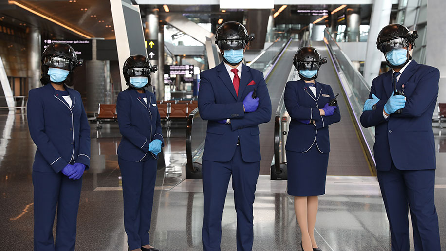 At Doha International Airport, staff are donning thermal screening helmets to assess travellers’ temperature