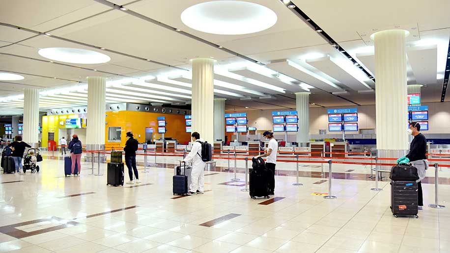 Physical indicators being placed on the ground and at waiting areas in the airport to ensure travellers maintain a safe distance