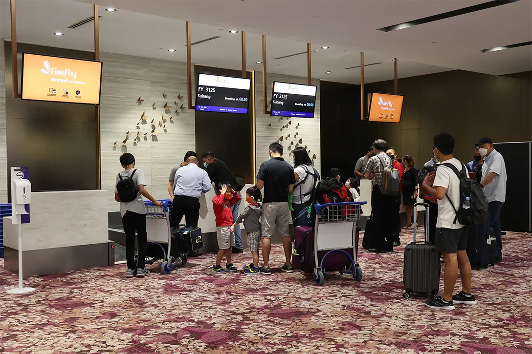 Passengers taking the Firefly's first flight FY3125 out from Seletar Airport to Subang. PHOTO: LIANHE ZAOBAO