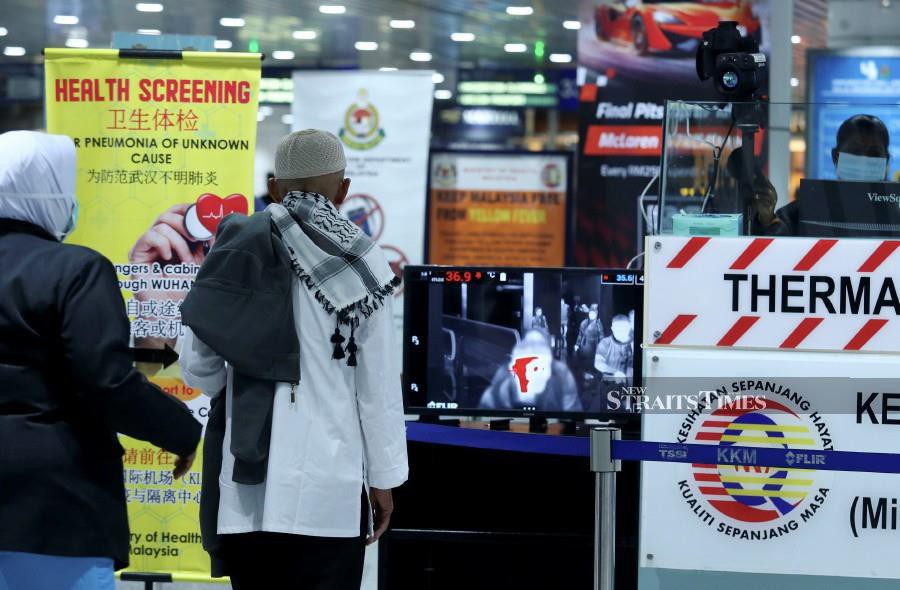 Tourists arriving at Kuala Lumpur International Airport (KLIA) are screened for any possible Covid-19 coronavirus symptoms. -NSTP/Ahmad Irham Mohd Noor.