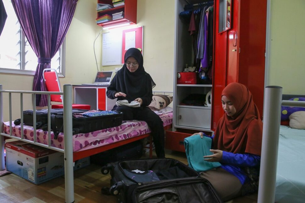File picture of UiTM students packing their belongings at their residential college at Kolej Perindu in Shah Alam April 25, 2020. 312 UMSKAL students were flown back to KLIA today after being stranded here since the start of the MCO on March 18. ― Picture by Yusof Mat Isa