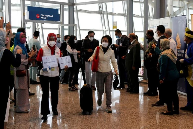 Travellers arriving at Kuala Lumpur International Airport under the Malaysia-Singapore Vaccinated Travel Lane scheme. PHOTO: EPA-EFE