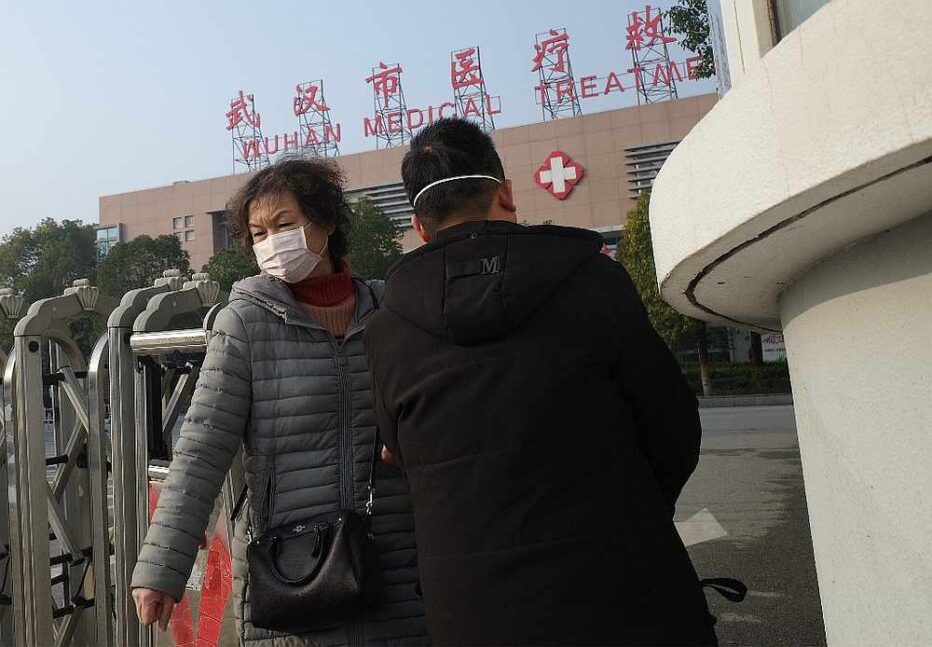 A woman leaves the Wuhan Medical Treatment Centre, where a man who died from a respiratory illness was confined, in the city of Wuhan, Hubei province January 12, 2020. — AFP pic